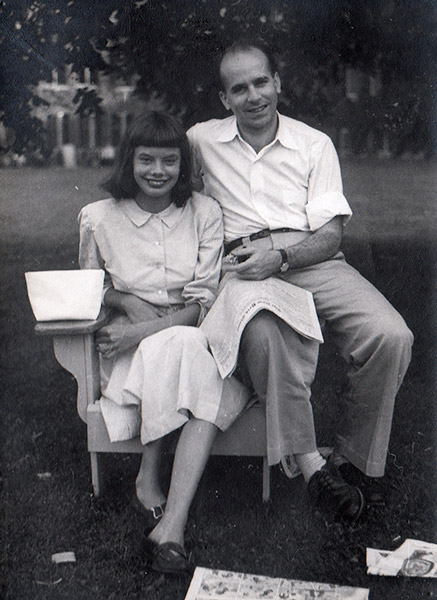 White man and woman sitting in chair smiling