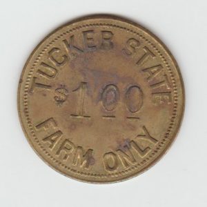 Round coin " Tucker State Farm Only One Dollar"