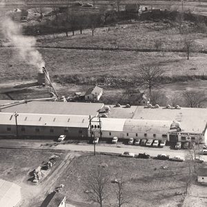 "Turkey Wood Products" warehouse building and parking lot as seen from above
