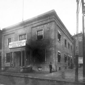 Two-story building with four columns and sign "Arkansas Division U.C.V."