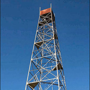 Steel framed lookout tower with ladders leading to the top
