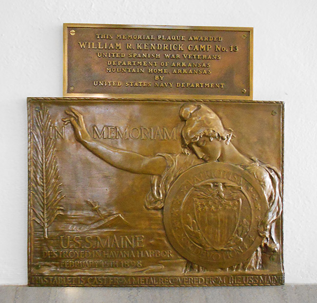 Bronze plaque for "William R. Kendrick Camp No. 13" above a bronze plaque depicting a woman holding a shield