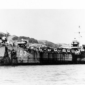 Naval vessel 1038 passing shore in San Francisco Bay