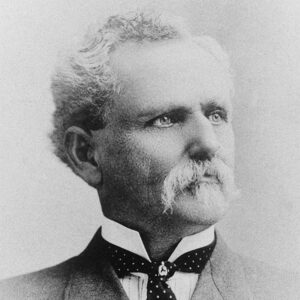 Old white man with mustache in suit and tie