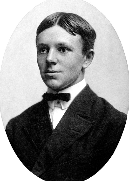 Young white man in suit and bow tie