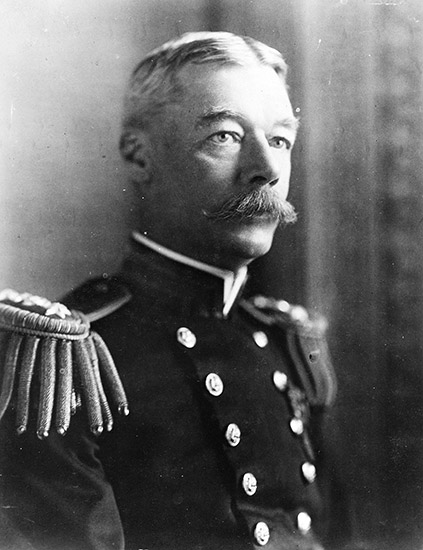 White man with mustache in military uniform with epaulets