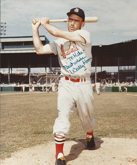 White man with cap swinging a bat in crowded stadium signed "To Mike Best Wishes Wally Moon"