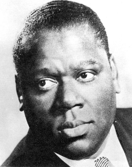 African-American man in suit and striped tie