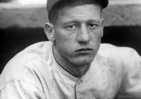 young white man in Chicago Cubs uniform and cap