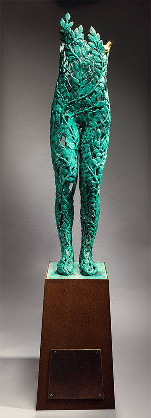 Green sculpture of legs and torso made from leaves