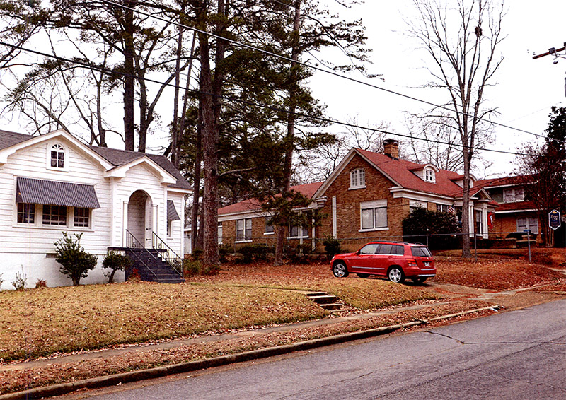 Multistory houses with covered porches on residential street