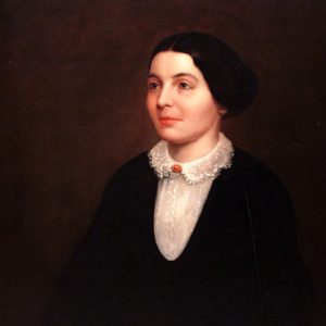 Portrait of white woman with lace collar dress and brooch