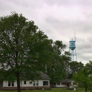 Single-story houses under water tower