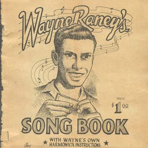 White man with harmonica and text on songbook cover