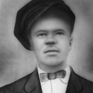 Young African-American man in hat and suit with bow tie