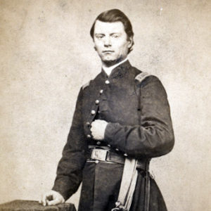 White man in military uniform with sword