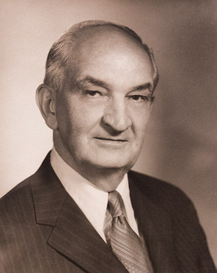 Older white man in suit and tie
