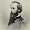 side view of White man with long beard in military uniform