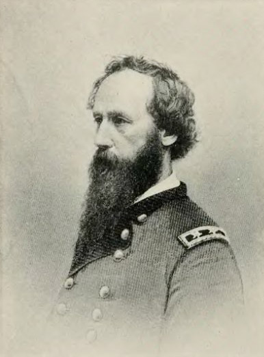 side view of White man with long beard in military uniform
