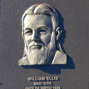 Bust of white man with long beard on "William Ellis" plaque