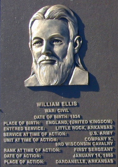 Bust of white man with long beard on "William Ellis" plaque