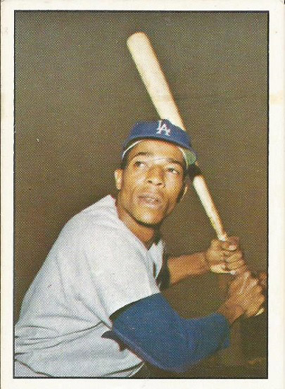 African-American man with baseball bat in uniform on card