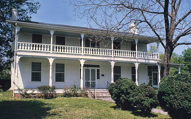 Two-story house with balcony and covered porch
