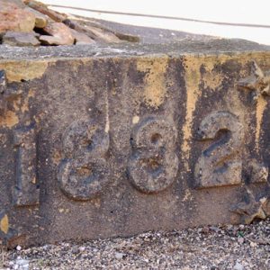 Stone with "1882" stamped on it