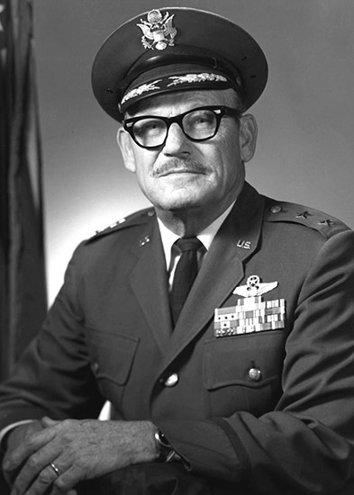 Old white man with mustache and glasses in military uniform