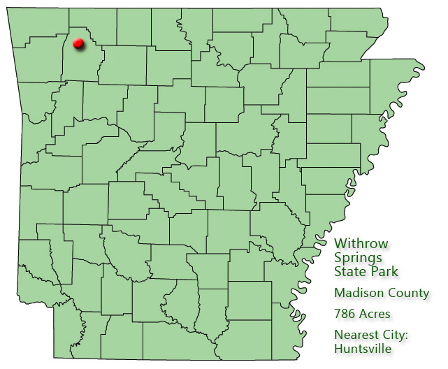 Map of Arkansas with red dot in Madison County and explanation in green text