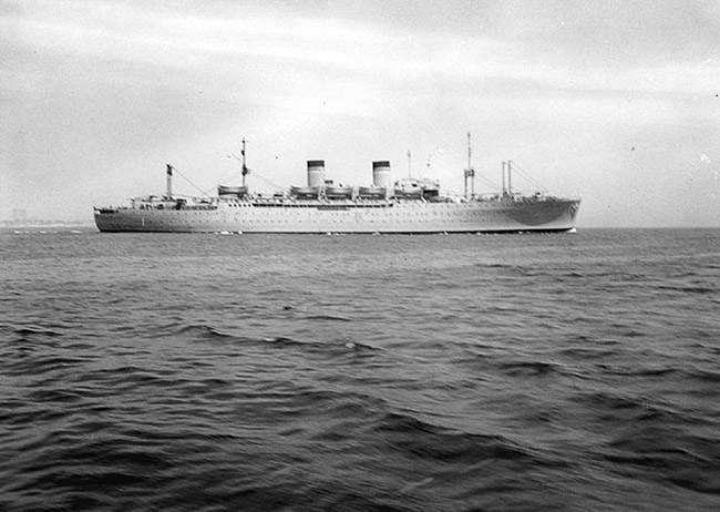 Large ship with two smoke stacks at sea