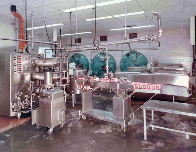 Interior of ice cream factory with packaging machine