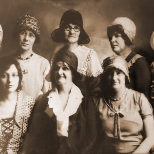 Group of white women in hats and dresses