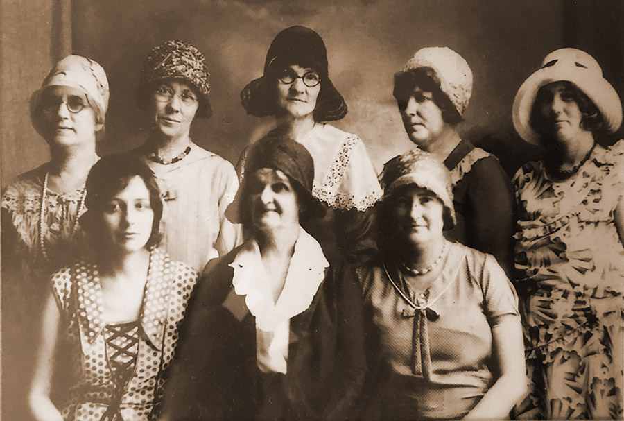 Group of white women in hats and dresses