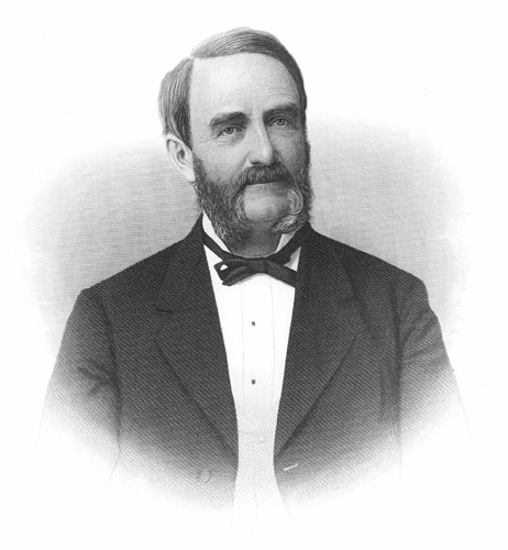 White man with beard and sideburns in suit and bow tie