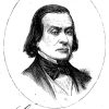 White man with long hair in suit and bow tie