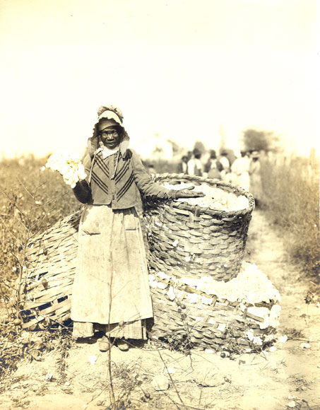African-American woman with baskets filled with cotton