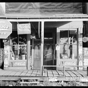 Storefront with "Cook's Beer" signs
