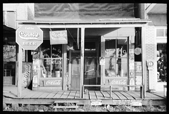 Storefront with "Cook's Beer" signs