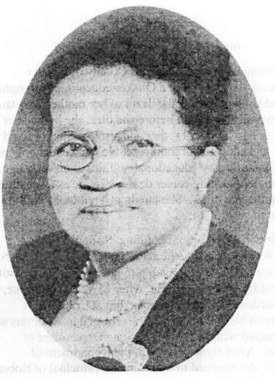 Oval portrait African-American woman wearing glasses, a pearl necklace, and dress