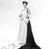 White woman in pageant dress and tiara signed "Best wishes Donna Axum Miss America 1964"