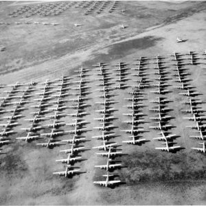 Aerial view of rows of parked airplanes in a field