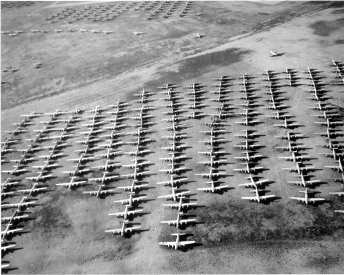 Aerial view of rows of parked airplanes in a field