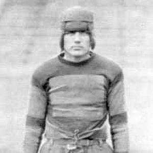white man in old-fashioned football uniform "Capt. Barnhill."