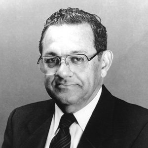 African American man with glasses in suit and tie