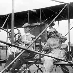 man and woman sitting in open air airplane