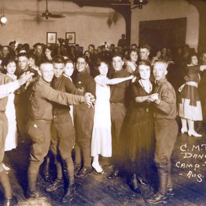 Women and uniformed men dancing, signed "C.M.T.C. Dance. Camp - Pike. Ark. Aug. 1921- #41."