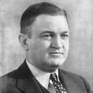 white man in suit and tie