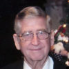 olde white man wearing a glasses and suit with bow tie
