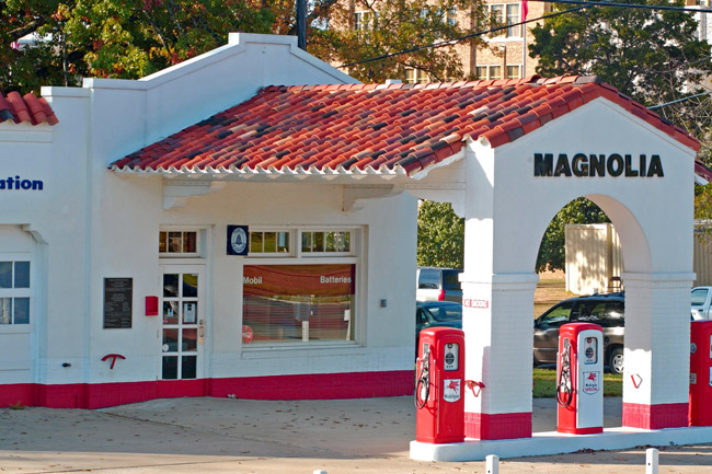 Single-story "Magnolia" gas station with covered entrance and three pumps